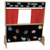 Wood Designs Deluxe Puppet Theater with Flannelboard, a wooden puppet theater featuring a blackboard with colorful animal and fruit cutouts and red curtains for puppet shows and storytelling.