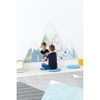 Moje Bambino Summit Mountain Wall Activity, children playing with mountain-shaped wall activity in a children's room.