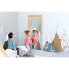 Moje Bambino Summit Mountain Wall Activity, children playing in a room with mountain-themed wall decorations and a large mirror.
