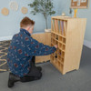 Whitney Brothers Cell Phone Locker, a wooden storage unit with multiple compartments and slots for organizing cell phones in a classroom or office setting.