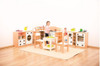 Moje Bambino Corner Play Kitchen, children's play kitchen set with stove, oven, and storage compartments in a playroom