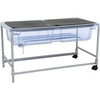 Moje Bambino Mobile Sand and Water Play Table, transparent plastic tray with sand and water compartments and a sturdy metal stand with wheels for mobility.