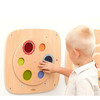 Moje Bambino Color Spin Sensory Wall Panel, child exploring the wooden wall-mounted sensory panel by spinning its colorful discs