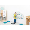 Moje Bambino Garden Sensory Wall Activity, child exploring a colorful garden-themed wall panel with sensory paths in a preschool classroom