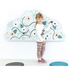 Moje Bambino Garden Sensory Wall Activity, child tracing a winding path on a wall-mounted garden-themed sensory panel with colorful flowers and leaves