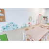 Moje Bambino Garden Sensory Wall Activity, colorful garden-themed wall panels with animal illustrations in a preschool classroom
