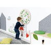 Moje Bambino Tree with Fox Sensory Wall Activity, child exploring a tree-themed wall panel with a fox, sliding beads, and interactive sensory elements in a classroom
