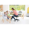 Moje Bambino Curved Horseshoe Table, green child-sized table with a curved horseshoe shape used by a caregiver and toddlers during mealtime in a bright classroom.