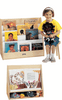 Jonti-Craft 1 Sided Pick-a-Book Stand, wooden book display stand holding children's books and learning materials with a young girl sitting next to it.
