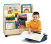 Jonti-Craft 1 Sided Mobile Book Browser - Pick-a-Book Stand, a wooden mobile book display with colorful picture books and a smiling boy sitting on the floor drawing.