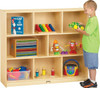Jonti-Craft Mega Mobile Single Storage Unit on Casters, wooden shelving unit with multiple compartments filled with toys, books, and educational materials, with a young boy playing beside it. Jonti-Craft Mega Mobile Single Storage Unit on Casters, wooden shelving unit with multiple compartments filled with toys, books, and educational materials, with a young boy playing beside it.