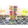 Whitney Brothers Storage Tower with 24 Trays, educational storage unit filled with colorful toy balls and blocks, flanked by two wooden chairs in a bright room.