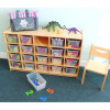 Whitney Brothers Cubby Storage Cabinet With 20 Trays, wooden cubby storage unit with clear plastic trays filled with colorful toys and craft supplies, placed on a carpeted floor in a playroom or classroom setting.