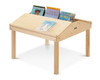Jonti-Craft Classroom Twin Reading Table, a wooden children's reading table with built-in book display at the back holding various children's books.