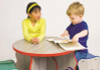 Playscapes Wavy Table and 4 Stool Set, children playing at the versatile wavy table with colorful stools in a playroom setting.