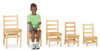 Jonti-Craft KYDZ Ladderback Chair - Set of 2, set of five natural wood children’s chairs with ladderback design, one child sitting on the middle chair with toys, smiling.