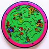 Lady Bug Lane Round Wall Toy, colorful maze game featuring cartoon ladybugs, a house, flowers, and playful insects on a green background with pink border.
