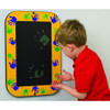 Playscapes Goldenrod Magic Hands Heat Sensitive Wall Panel, a child touching and engaging with a colorful, heat-sensitive wall panel decorated with green and blue handprints.
