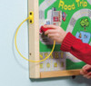 Playscapes Replacement Wands for Magnetic Wall Toys & Activity Tables, Set of 4, yellow wand being used on magnetic wall panel during a child's play session.