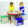 Playscapes Kids Wavy Stools, colorful wavy shaped children’s seating around a table with two kids engaging with a book.