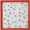 Playscapes Letters Magnetic Educational Wall Activity, image of magnetic alphabet letters scattered on a whiteboard with a red frame.