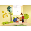 HABA Pro Tree and Animals Meadow Interactive Wall Decor, colorful wooden wall decor with trees, animals, moon, and stars for children's playroom.