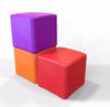 Playscapes Children's Eco Cube Seating, colorful stackable foam cubes in purple, orange, and red designed for children's indoor and outdoor seating and play.