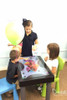 After Mouse Interactive Play Touch Table with Custom Company Logo, children engaging with an interactive touchscreen game at a pediatric dentistry office.