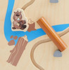 HABA Pro The Forest Wall Activity Panel, wooden animal figure and colorful puzzle pieces on a light wood surface.