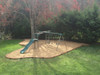 Frame It All Classic Sienna Curved Playground Border Border 16' - 1" Profile, garden playground area with playset and sand border.