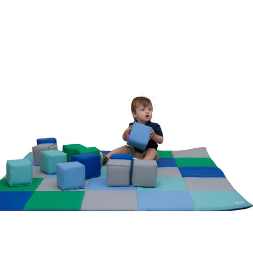 Children's Factory Patchwork Activity Mat & Foam Block Play Set, Contemporary, with a young child sitting on the colorful padded activity mat surrounded by foam blocks.