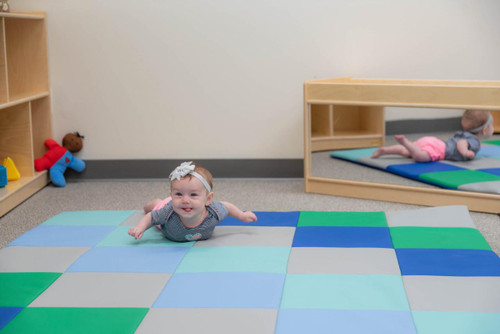 Children's Factory Patchwork Activity Play Mat, Contemporary, colorful foam surface with children playing and crawling on it in a children's playroom.