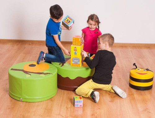 Novum Green Beehive Tree Table, children playing with colorful stacking blocks and bee-themed storage box in a children's playroom.