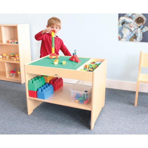 Whitney Brothers Construction Site Activity Table, a wooden play activity table for children with building blocks and construction toys, in a playroom setting.