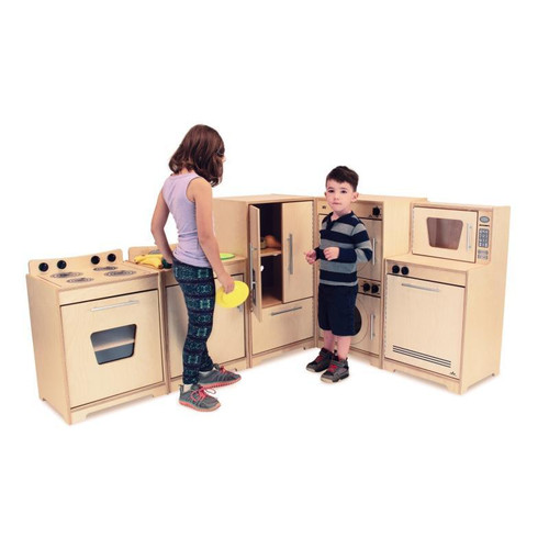 Whitney Brothers Contemporary Natural Play Kitchen Ensemble, children playing with wooden play kitchen set featuring stove, microwave, and cupboard doors.