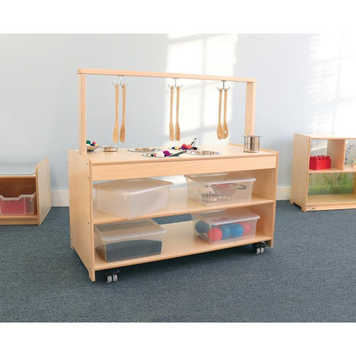Whitney Brothers Mobile Sensory Play Kitchen, wooden sensory play kitchen on wheels with hanging utensils and storage bins for children's play and learning.