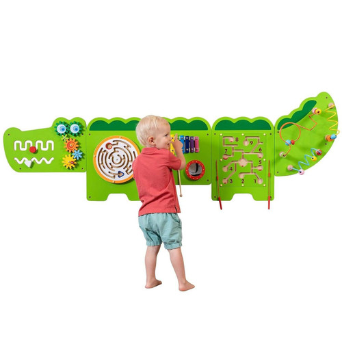 SPARK & WOW Crocodile 5-Activity Sensory Wall Panel, colorful and interactive sensory wall panel designed for children with various activities including gears, maze, xylophone, and maze, mounted on a green crocodile-shaped board.