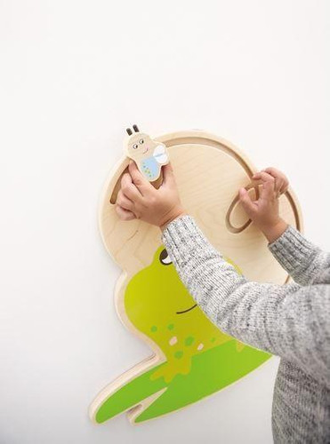 HABA Pro Freddie the Frog Interactive Wall Decor, a green frog-shaped wall mounted toy with a Freddie the Frog character attached.