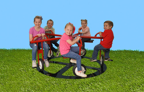 Playtime Playground Equipment Playground Merry Go Around Cycle, children playing and smiling on a red carousel playground equipment on a grassy field with a blue sky background.