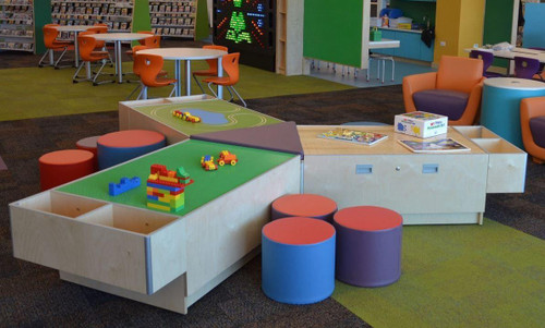 Playscapes 3-Branch Pinwheel Triple Discovery Table, play area with colorful seating and educational toys.