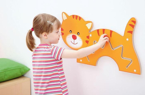 Moje Bambino Kitten Shift Sensory Wall Panel, a young girl engaging with an orange cat-shaped sensory wall panel with metal zigzag and straight lines for tactile play.