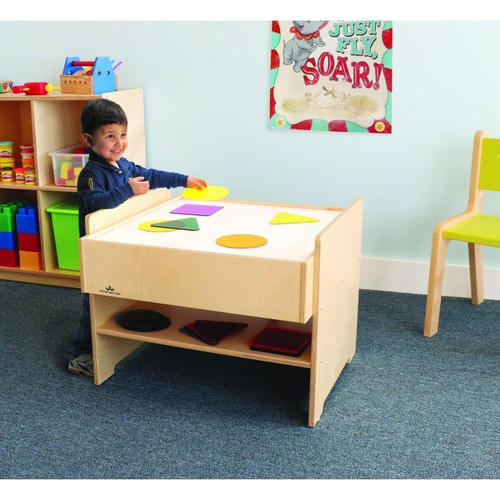 Whitney Brothers Superbright LED Kid's Light Table, children playing with colorful geometric shapes on a lighted children's table in a classroom.