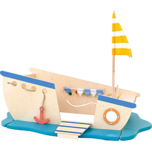 Moje Bambino Pirate Ship Play Boat Climber, wooden play boat designed as a pirate ship with a sail, rope ladder, colorful flags, and a small platform for children to climb and play.