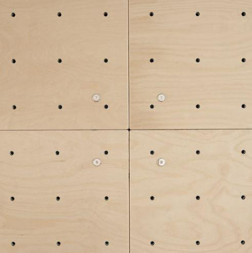 HABA Pro Kid's Small Climbing Wall, wooden climbing panels with multiple holes for hand and foot placement.