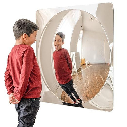 SPARK & WOW Acrylic Bubble Mirror -1 Giant Bubble, a large round acrylic bubble mirror reflecting a young boy smiling and looking at his reflection.