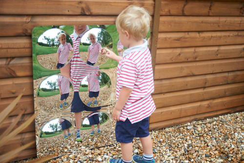 SPARK & WOW Acrylic Bubble Mirror - 9 Giant Bubbles, young boy looking at a large reflective bubble mirror with multiple bubble reflections of him in an outdoor setting.