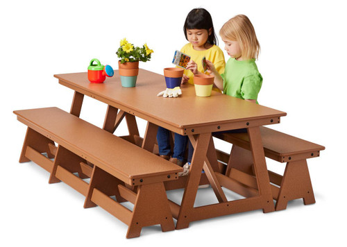 Jonti-Craft EverPlay Large Outdoor Table And Bench Set, wooden outdoor play table with two benches and children playing with gardening supplies and toys.