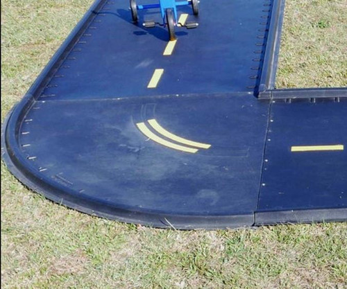 Infinity Playgrounds Trike Path Single Curve Piece, black rubber roadway playground equipment with painted yellow lane markings for tricycle riding.