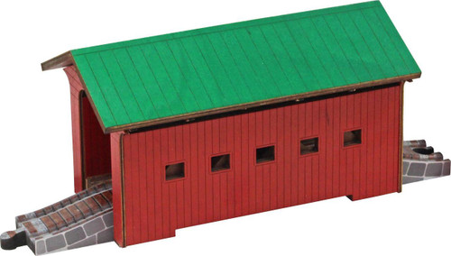 Maple Landmark Arlington Covered Wooden Train Bridge, a colorful wooden train bridge with a green roof and red sides with small windows, placed on train tracks.