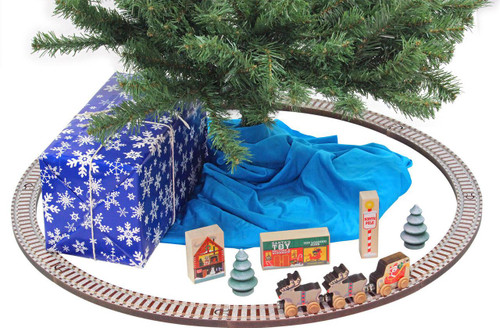 Maple Landmark Christmas Tree Wooden Train Set, festive Christmas scene with wooden train tracks, a decorated tree, presents, and holiday-themed accessories.
